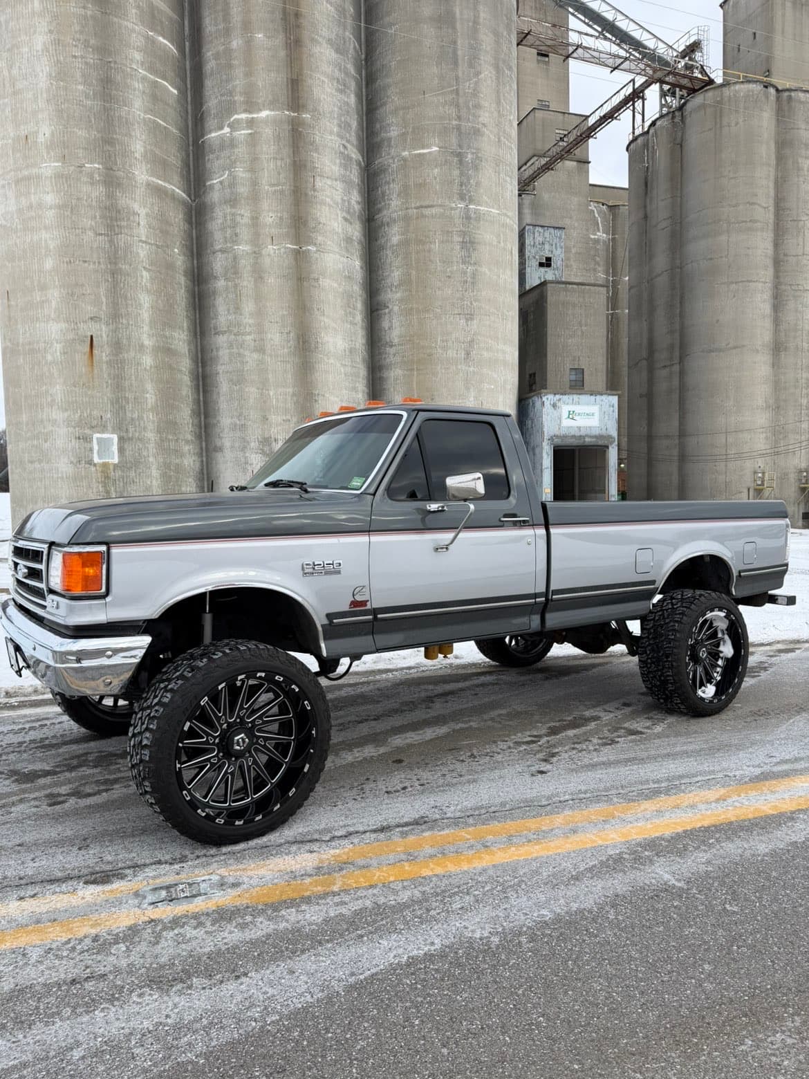 Grey OBS F-250 lifted at grain silos
